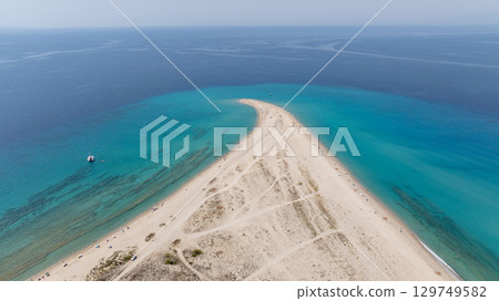 Aerial view of Possidi cape, Kassandra, Halkidiki, Greece, showcasing the meeting of white sand and turquoise water 129749582