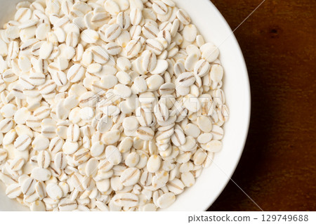 Close-up of rolled barley in a plate Close-up of rolled barley in a plate 129749688