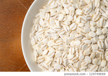 Close-up of rolled barley in a plate Close-up of rolled barley in a plate 129749689