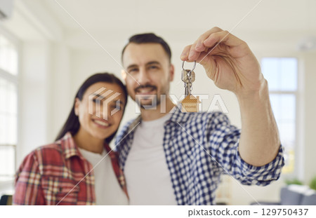 Happy Family Holding Keys to New Home Happy Family Holding Keys to New Home 129750437