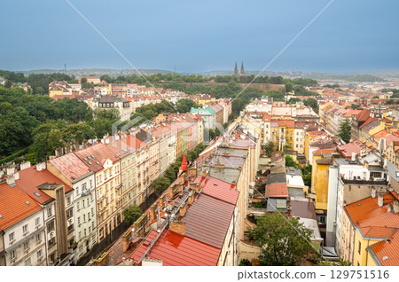 Prague, Czech Republic, August 5, 2023. Aerial view of the suburbs: houses with colorful facades and red roofs, rainy day. Travel photography. 129751516