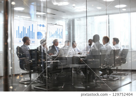 Diverse Team Engaged in Strategic Legal Meeting with Charts and Data Presentations 129752404