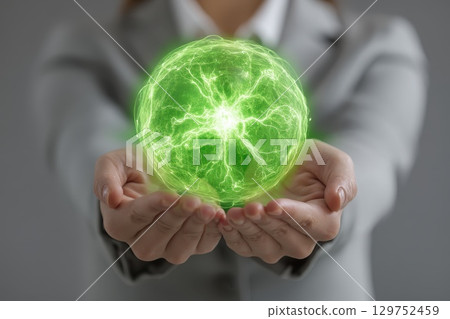 Businesswoman Holding Glowing Green Globe Symbolizing Innovation and Global Sustainability Businesswoman Holding Glowing Green Globe Symbolizing Innovation and Global Sustainability 129752459