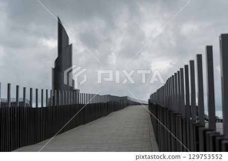 Frozen fountain on the background of cloudy sky, bridge, Batumi Frozen fountain on the background of cloudy sky, bridge, Batumi 129753552