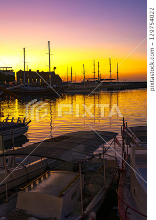 Photo of Kyrenia harbor at sunset in the Turkish Republic of Northern Cyprus Photo of Kyrenia harbor at sunset in the Turkish Republic of Northern Cyprus 129754022
