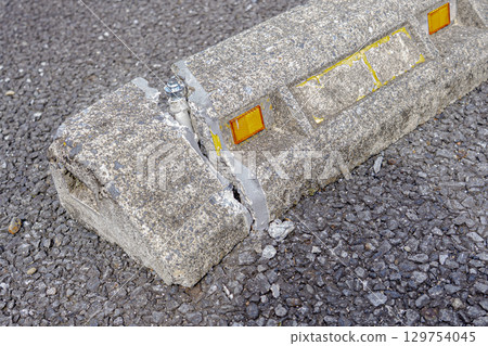 Close-up of a cracked concrete bollard Close-up of a cracked concrete bollard 129754045