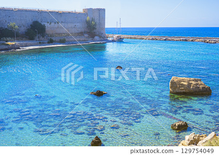 Photo of emerald green sea and boats near Girne Castle in the Turkish Republic of Northern Cyprus 129754049