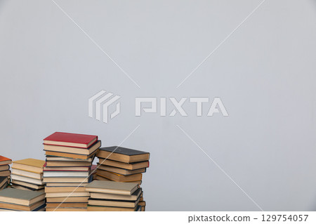 Stacks of educational books for study in the library on a white background 129754057