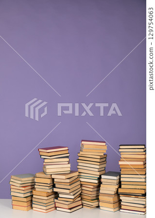 Stacks of educational books to study in the library as the background of the university Stacks of educational books to study in the library as the background of the university 129754063