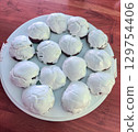 Gingerbread. Sweet gingerbread on white background. Homemade baked goods. Iced sugar gingerbread 129754406