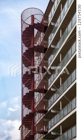 Spiral staircase outside the apartment 129754530