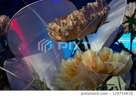 Dynamic and innovative installation of artificial flowers with interactive, self opening buds. This captivating artwork blends nature and technology, creating mesmerizing visual experience Dynamic and innovative installation of artificial flowers with interactive, self opening buds. This captivating artwork blends nature and technology, creating mesmerizing visual experience 129754678