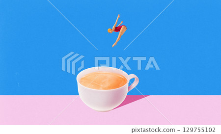 Female diver jumping into coffee cup with determined focus 129755102