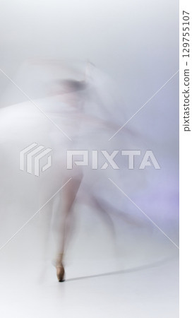 Abstract motion blur of ballerina dancing in flowing movement Abstract motion blur of ballerina dancing in flowing movement 129755107