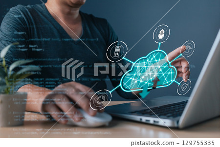 professional uses a laptop with a holographic cloud computing, symbol cloud technology, digital transformation, data management, cybersecurity, and system efficiency in modern tech solutions. professional uses a laptop with a holographic cloud computing, symbol cloud technology, digital transformation, data management, cybersecurity, and system efficiency in modern tech solutions. 129755335
