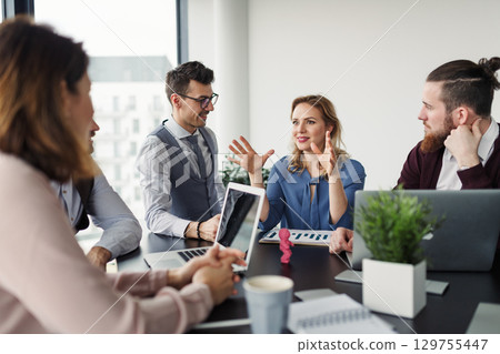 Business colleagues sharing ideas, discussing new project. Business colleagues sharing ideas, discussing new project. 129755447