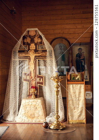 Large cross with the crucifixion of Jesus Christ in Orthodox Church 129755561