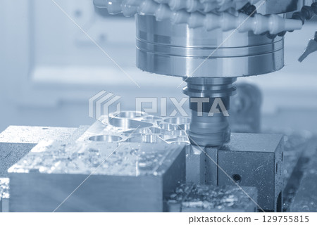 The CNC milling machine rough cut the aluminum parts with face mill tool  in the blue tone scene 129755815