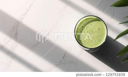 Top view of matcha latte on a white marble table_1 129755839