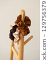 Neutral scrunchies on wooden rack 129756379