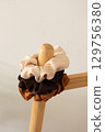 Minimalist composition of satin scrunchies, close-up 129756380