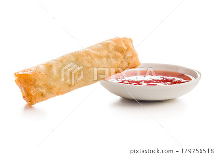 Fried spring rolls and sweet and sour sauce isolated on white background. Fried spring rolls and sweet and sour sauce isolated on white background. 129756518