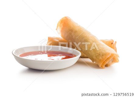 Fried spring rolls and sweet and sour sauce isolated on white background. 129756519