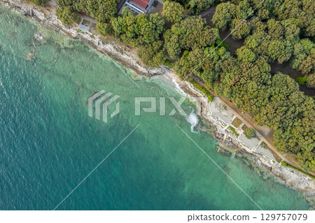 Rocky coastline with clear turquoise water in Istria, Croatia. Rocky coastline with clear turquoise water in Istria, Croatia. 129757079