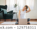 Woman stretching workout at home 129758311