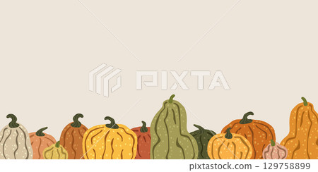 Colorful pumpkins forming a seamless border on a beige background 129758899