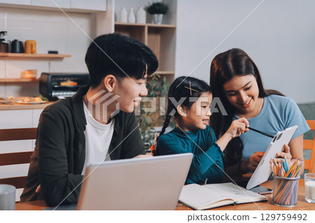 Family spends their free time together Family spends their free time together 129759492