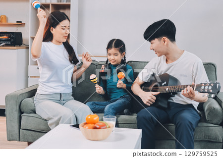 Family spends their free time together Family spends their free time together 129759525