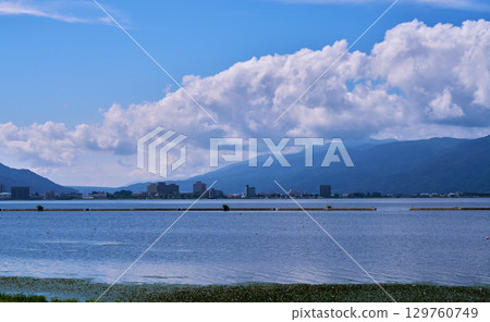 Lake Suwa surrounded by summer sky and clouds Lake Suwa surrounded by summer sky and clouds 129760749