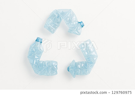 Crumpled plastic bottles forming a recycling symbol on a white background. concept of environmental conservation, waste management, eco-friendly practices 129760975
