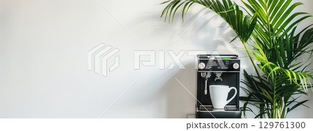Modern Coffee Machine and Grinder on Minimalist Countertop with Green Plant. Concept of Home Brewing, Kitchen Decor, Coffee Enthusiast, Modern Lifestyle. Banner. Copy space 129761300