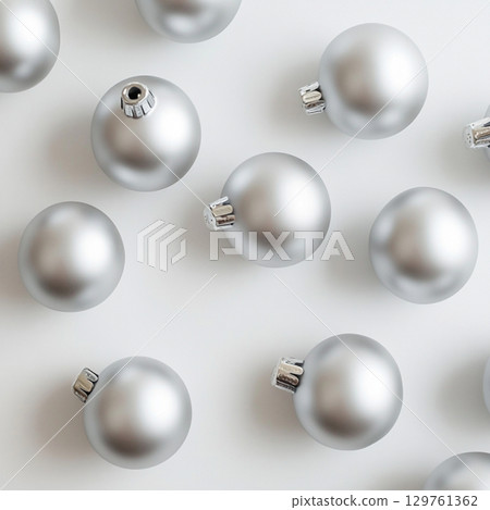 Silver Christmas tree toys on white background. Clipart with balls for text . Wallpaper for design 129761362