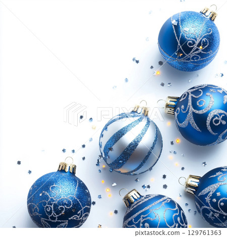 Blue Christmas tree toys on white background. Clipart with balls for text . Wallpaper for design 129761363