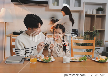 Family spends their free time together 129761503