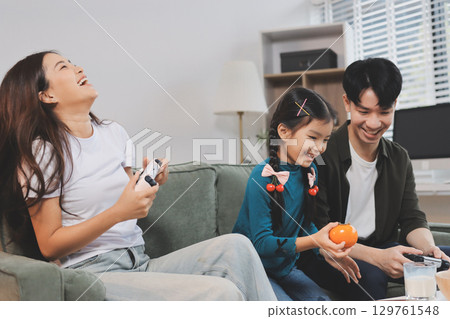 Family spends their free time together Family spends their free time together 129761548