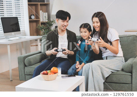 Family spends their free time together Family spends their free time together 129761550