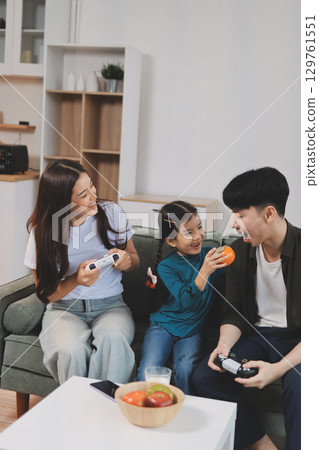 Family spends their free time together Family spends their free time together 129761551