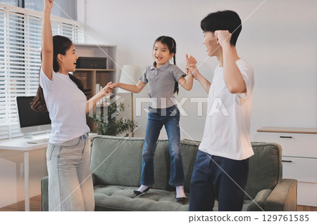 Family spends their free time together Family spends their free time together 129761585