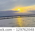 Golden sunset over a beautiful and calm lake in Europe 129762048