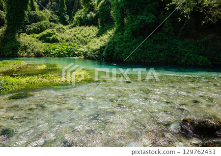 clear water and forest in Blue Eye Nature Monument near to Saranda, Albania clear water and forest in Blue Eye Nature Monument near to Saranda, Albania 129762431