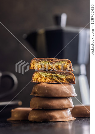 Dubai style chocolate cookies on black table. Dubai style chocolate cookies on black table. 129762436