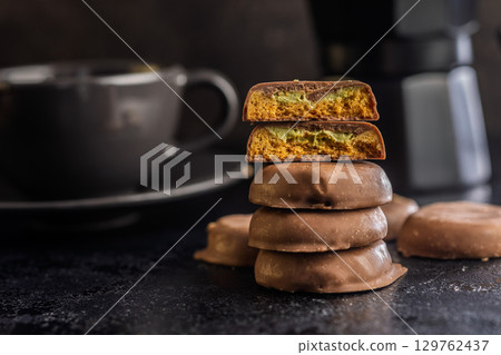 Dubai style chocolate cookies on black table. Dubai style chocolate cookies on black table. 129762437