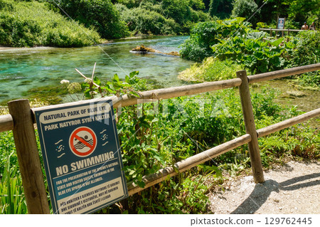 NO SWIMMING sign at Blue Eye Nature Monument near to Saranda, Albania 129762445