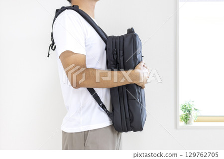 Man wearing a business backpack (faceless, 30s, Japanese) 129762705