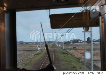 View from a single-lane train window 129762834