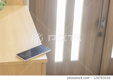 Image of a smartphone left at the entrance Image of a smartphone left at the entrance 129763016